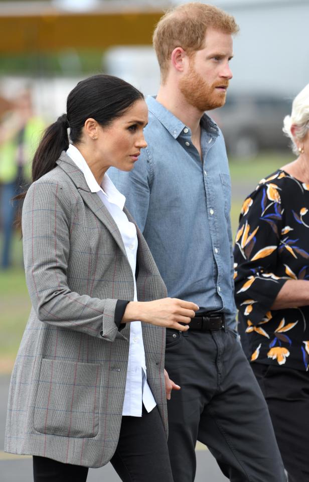  Meghan with husband Harry - who was photographed dressed as a Nazi in 2005