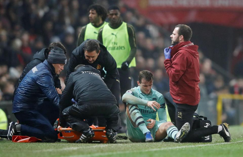  Rob Holding was unable to play on after the clash with Marcus Rashford