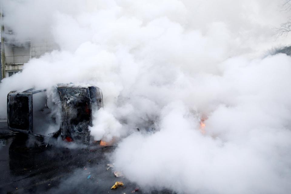  French firemen extinguish a burning car in Nantes today