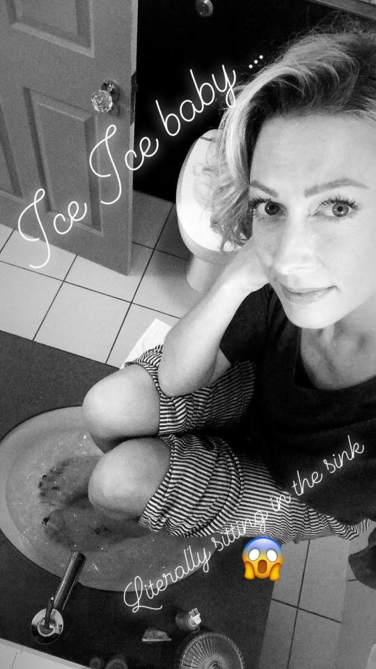  Faye Tozer bathe's her feet in ice