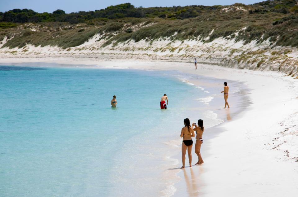  Swimmers and sun worshippers enjoy the tranquillity of Salmon Bay on Rottnest Island