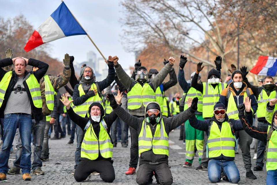  Protesters shout slogans near the Arc de Triomphe in Paris