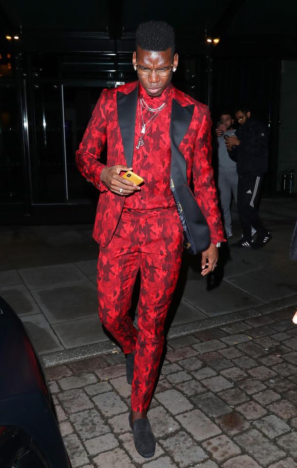 Paul Pogba looked particularly dashing in his red and black suit