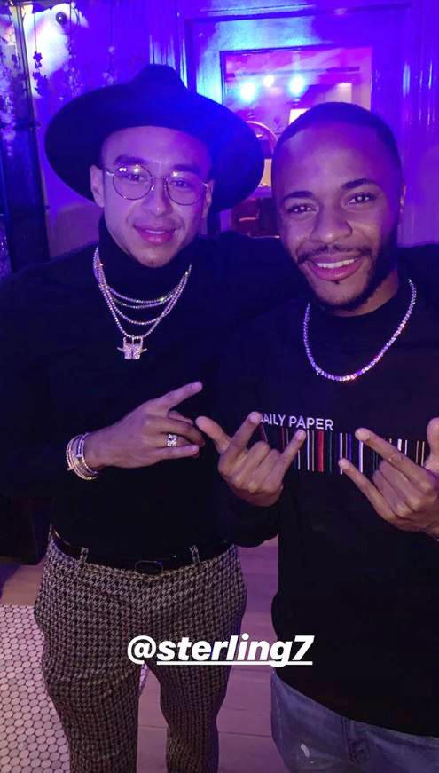 Jesse Lingard and Raheem Sterling pose for a photo at the JLIngz clothing party