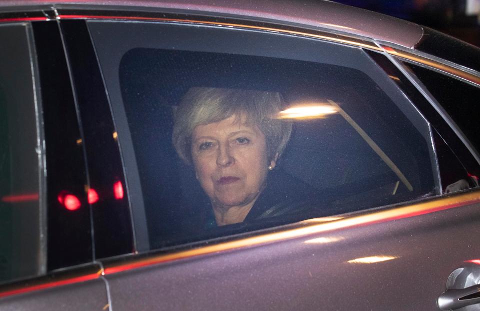  The Prime Minister looked pensive as she left Parliament after calling off the Brexit vote