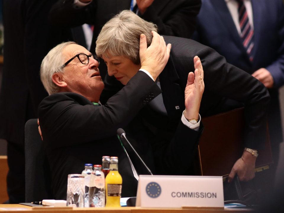  Mrs May was embraced by European Commission boss Jean-Claude Juncker