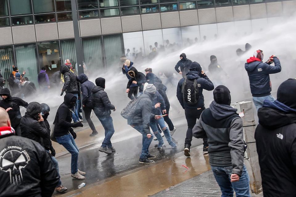  Water cannons are fired at protesters at a demonstration in Brussels