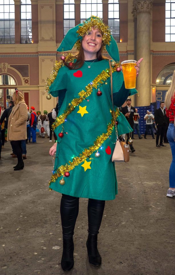  One fan dressed up as a Christmas tree as she got into the festive spirit