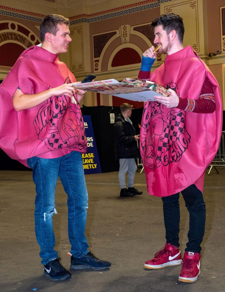  Two darts fans were blowing a load of hot air after dressing up as whoopee cushions