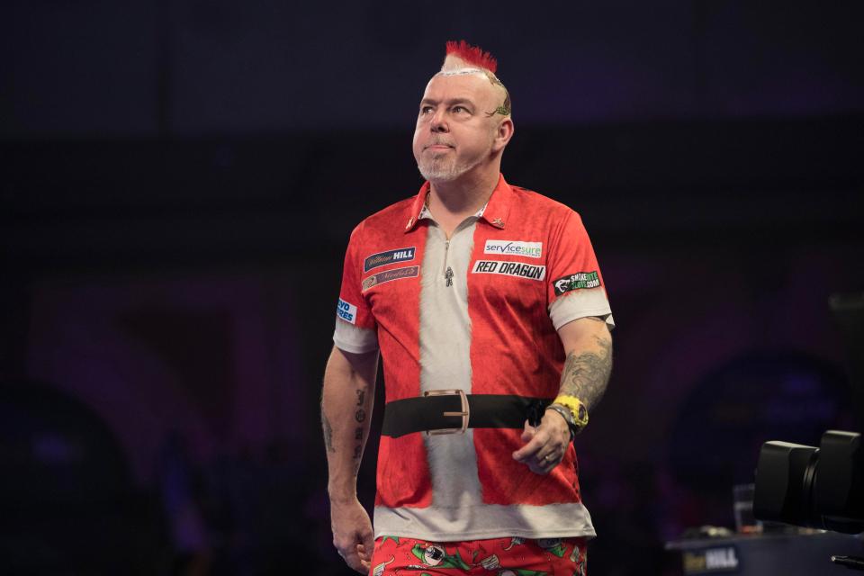  Peter Wright crashed out of the World Darts Championship to Toni Alcinas