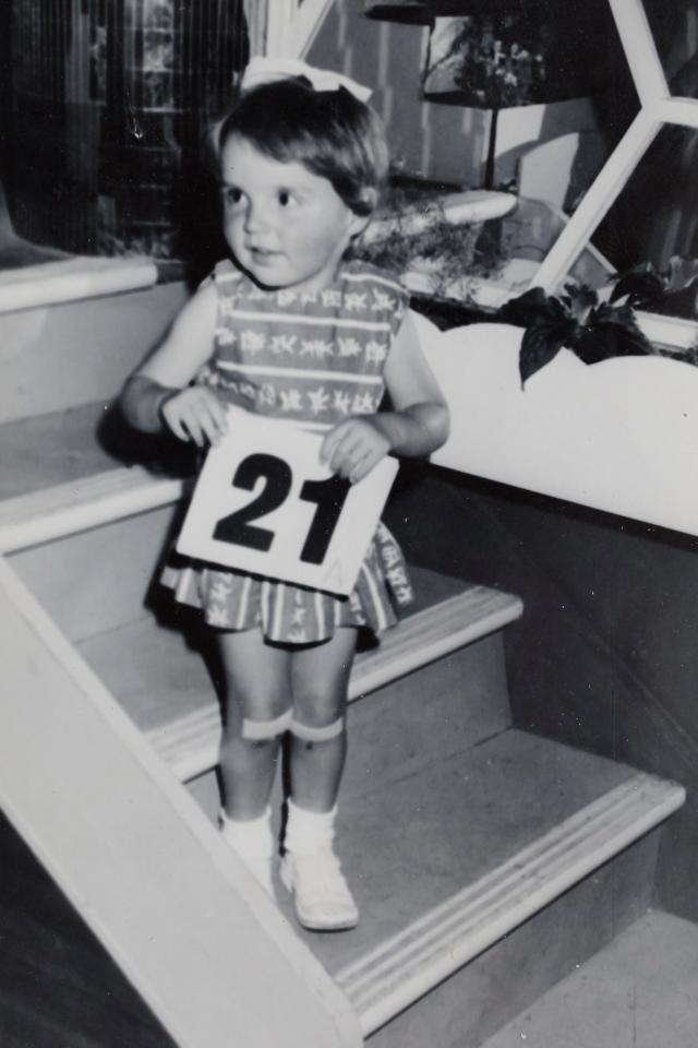 Karin, aged two, on holiday at Pontins and sporting plasters on her knees which she almost always wore as a result of frequent falls caused by her illness