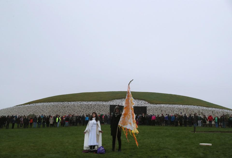  People gather for sunrise at Newgrange on the morning of the Winter Solstice, which is marked by pagan celebrations