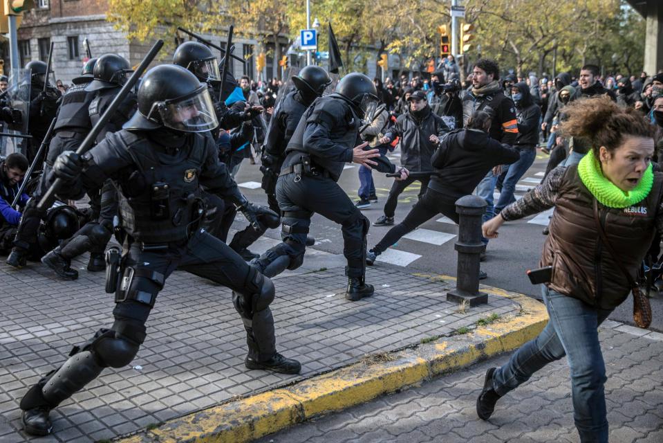  Police use their bludgeons against the protesters