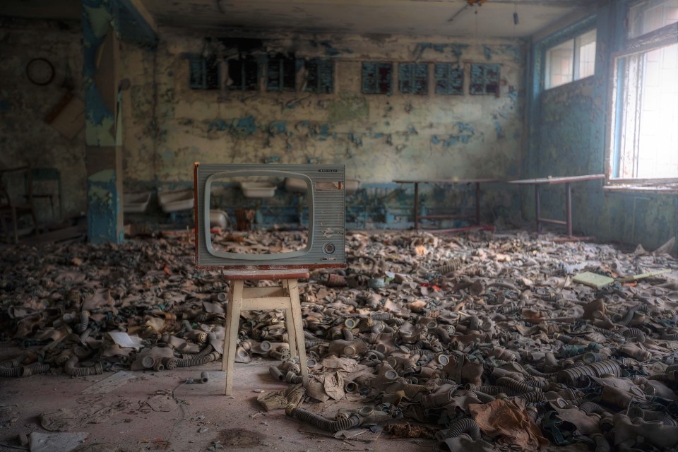 Gas masks litter the floor in one of the abandoned buildings in Pripyat, which was evacuated during the Chernobyl disaster