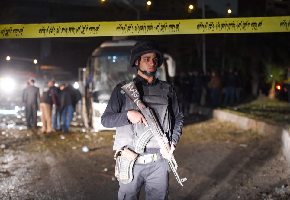  A member of the Egyptian security forces stands guard at the scene