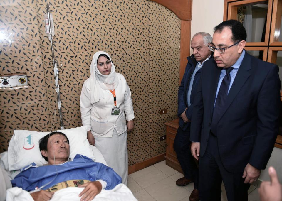  Egypt’s Prime Minister Moustafa Madbouly, right, visiting a Vietnamese tourist injured at a hospital after a bomb explosion, near Mariottia Corridor, Giza