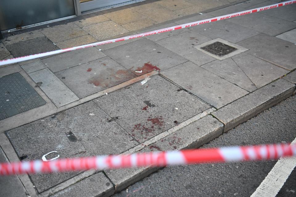  Blood splatters on the pavement were visible as cops continued probing the incident this morning