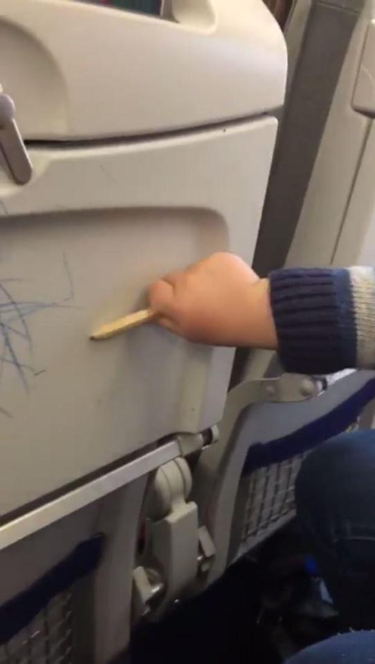  The child managed to cover all the tray tables with pencil marks