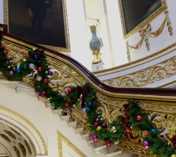 The garland along the grand staircase is adorned with baubles