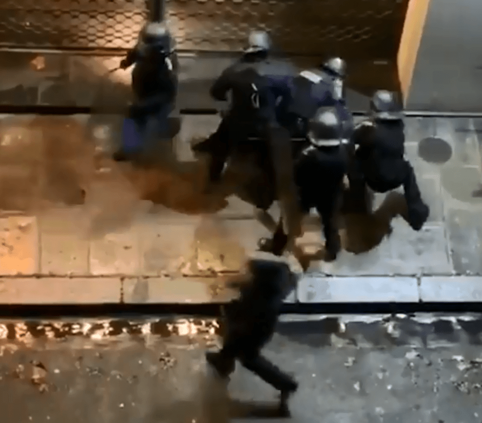  Seven cops in total take turns to kick and beat the cowering man amid the worst riots in the city since 1968