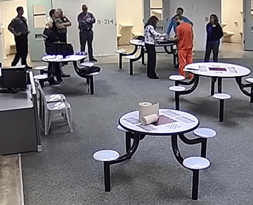  He was filmed having his finger and footprints taken in the Weld County Jail in October