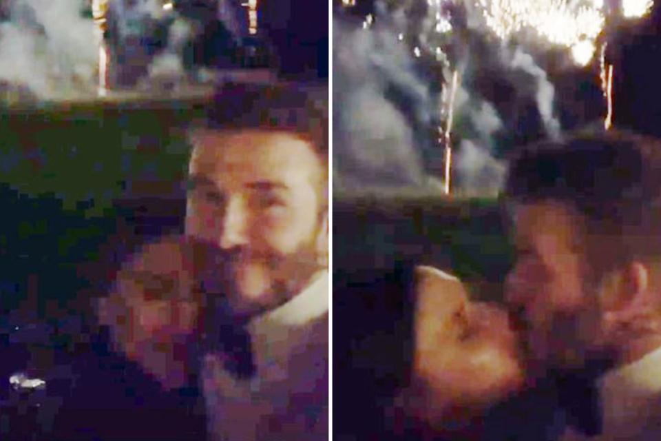  He also had an awkward-looking kiss with wife Victoria as the fireworks erupted