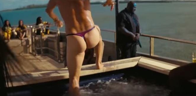  Film fans get a glimpse of Matthew's physique as he flashes his cheeky rear in a metallic purple thong