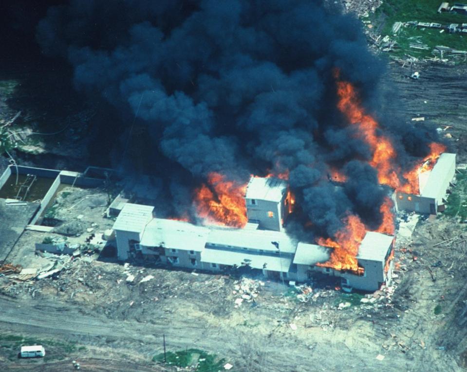  Fire consuming the David Koresh-led Branch Davidian cult compound, Waco, Texas, on April 19, 1993