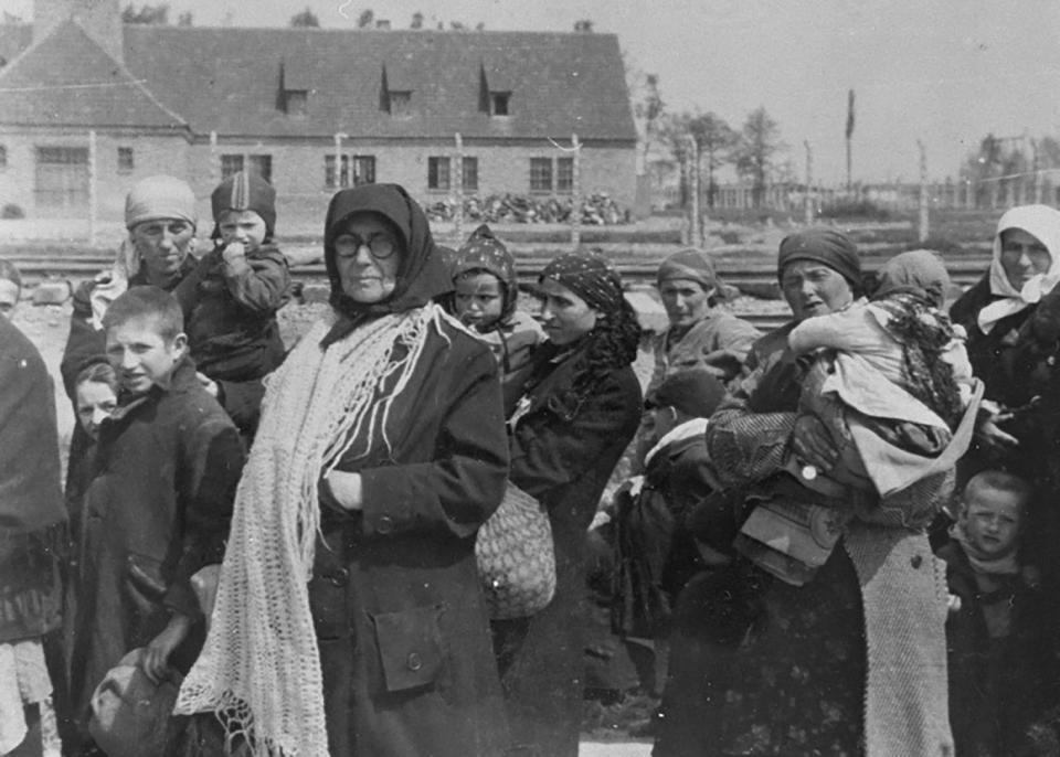  Jewish women and children walk toward the gas chambers at Aushwitz-Birkenau