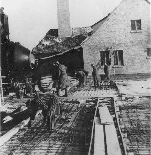  Prisoners here are seen pouring concrete for the ceiling of an underground undressing hall of gas chamber and Crematorium II at Auschwitz II-Birkenau