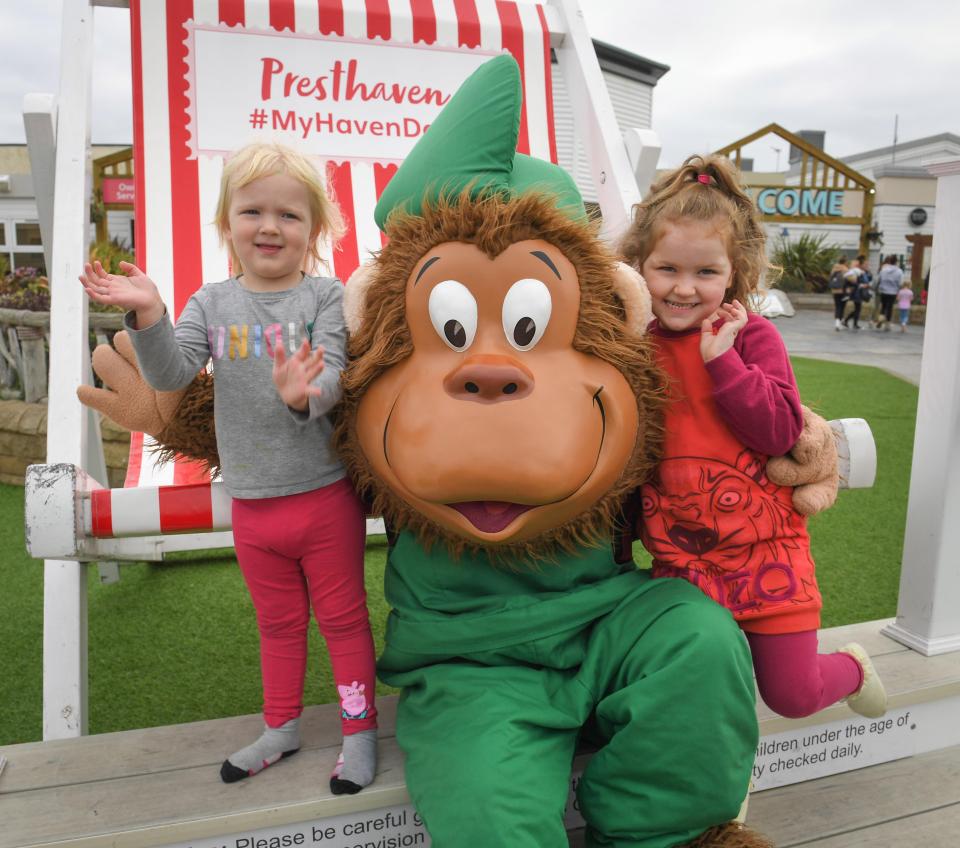  Sisters Erica and Evana Parkinson, five and three, loving having fun with Greedy the Gorilla at Haven Presthaven in North Wales