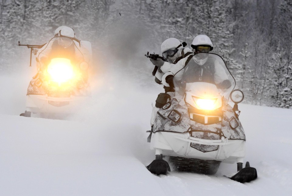 Russia’s Arctic mechanised infantry brigade riding snowmobiles in the Murmansk region