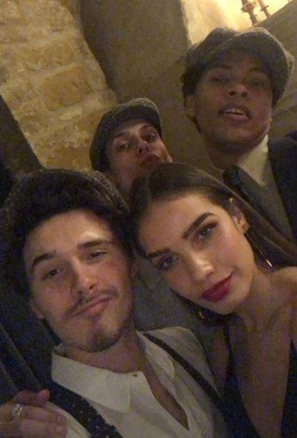  Hana posed with Brooklyn and his flat-cap-wearing friends at the Cotswold celebration