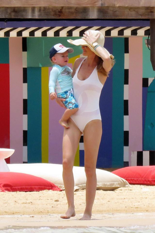  Storm looked great in a white swimsuit as she spent some quality time with her son