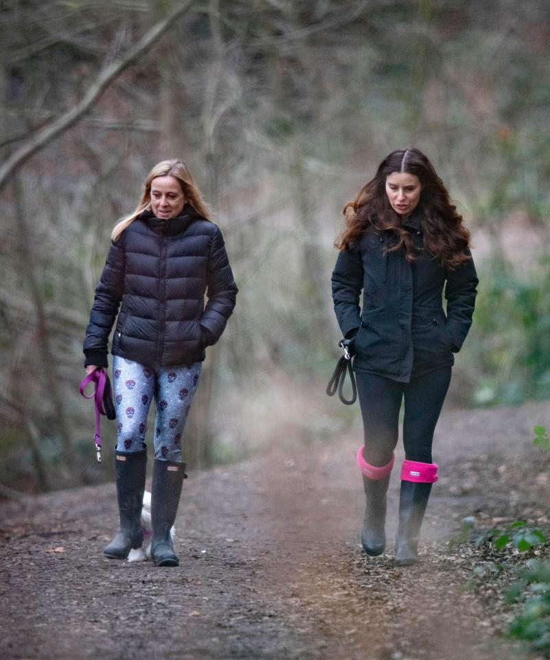  Tana strolled alongside a friend on a woodland trail