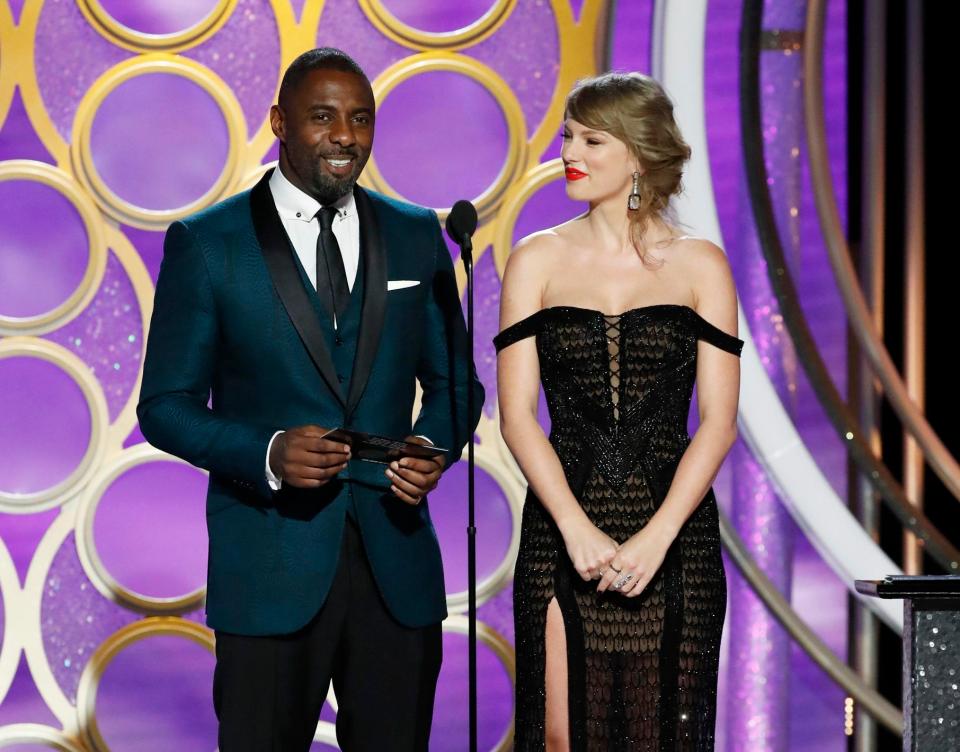  Taylor Swift presented a Golden Globe with Idris Elba - but snubbed the red carpet