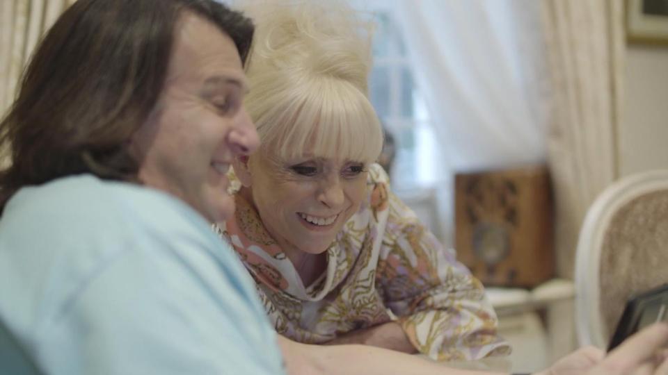  Dame Barbara Windsor and husband Scott watch a message of support from her old Albert Square pals