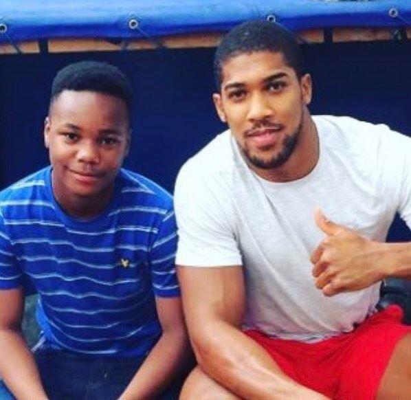 The young boy was an aspiring boxer, seen here posing with Anthony Joshua