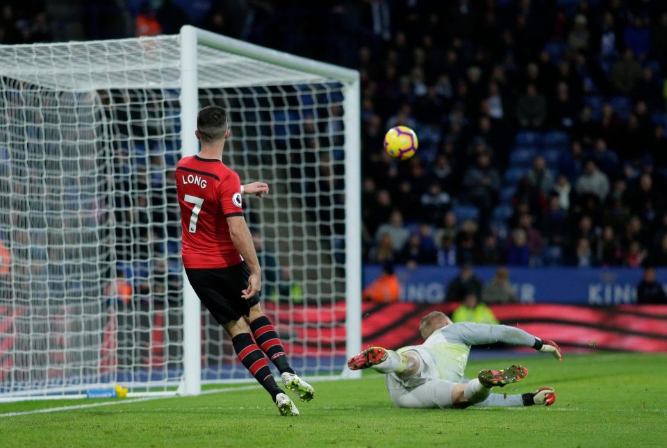  Shane Long squeezes the ball under Kasper Schmeichel to put Southampton two up before half time after Yan Valery's red card