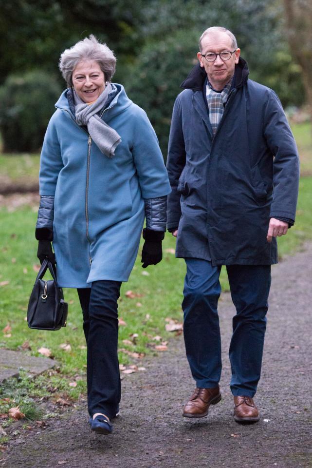  Theresa May pictured heading to church near her home today