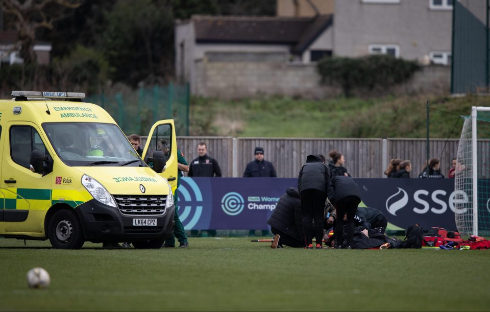  The players were forced back into the changing rooms whilst she received treatment