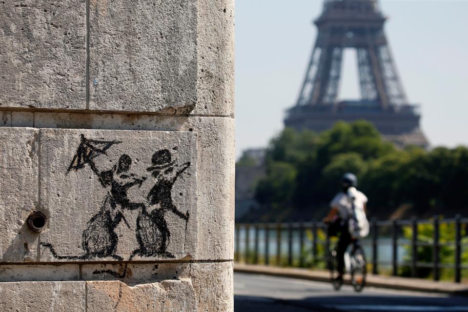  A similar artwork from the artist was sprayed near the Eiffel Tower