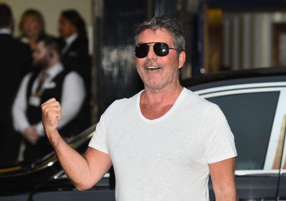  Simon looked much more like himself when he turned up at the Palladium with shades on