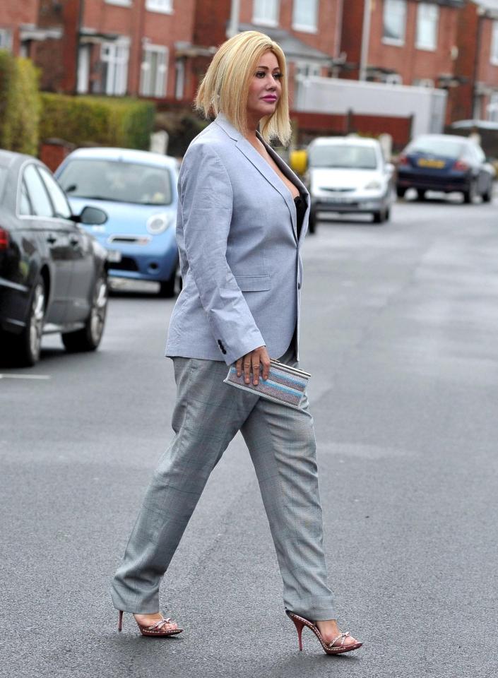  She strutted her stuff in a grey suit and heels