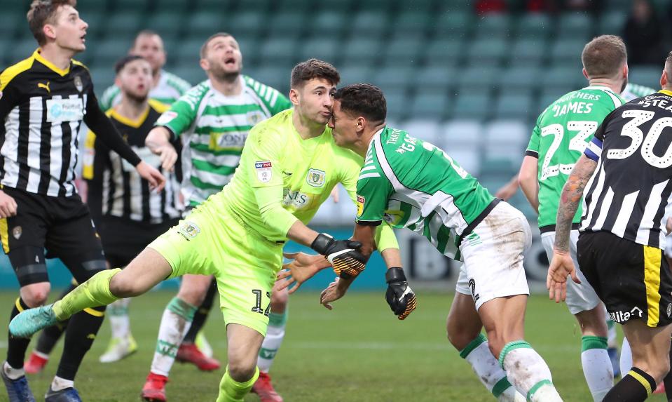  Yeovil keeper Nathan Baxter went head-first into Adel Gafaiti after a corner