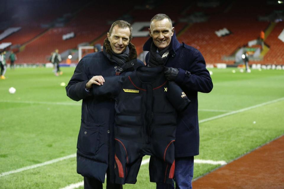  Nelson with Real Madrid legend Emilio Butragueno - in 2012, Los Blancos ordered 50 of the suits after watching just one presentation