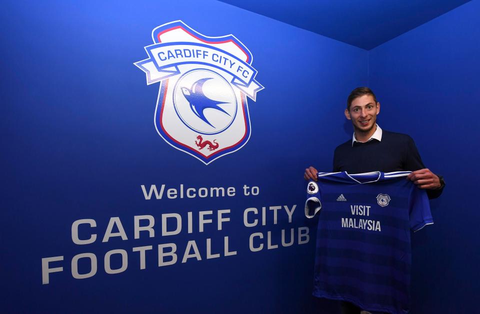  Emiliano Sala poses with his Cardiff shirt after signing for the club