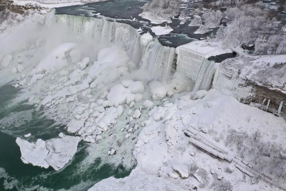  An aerial photo taken over the American side shows water flowing around ice due to subzero temperatures in Niagara Falls, New York