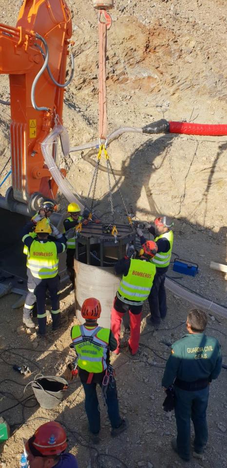  Rescue workers fit the cage which will carry miners into the second shaft