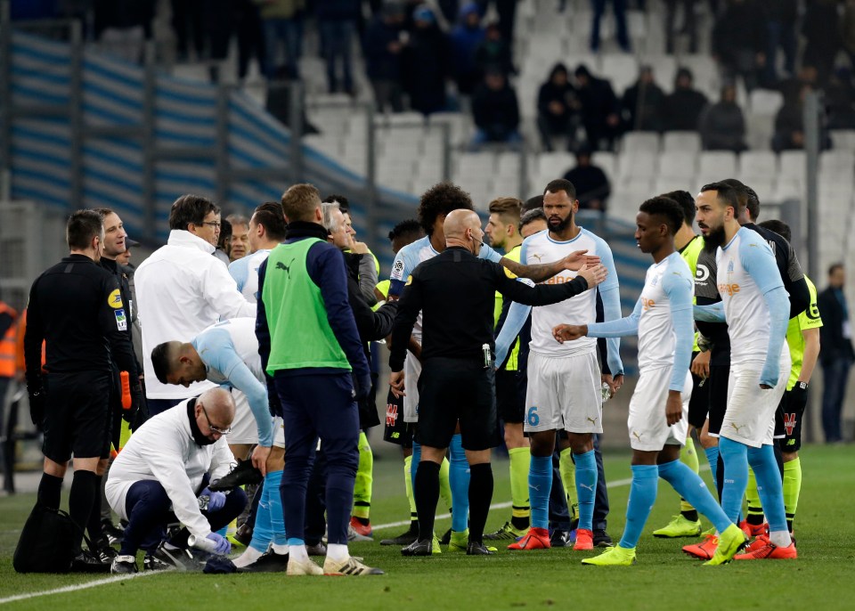 Referee Amaury Delerue ordered both teams to leave the pitch